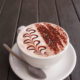 close up beautiful top dressing fern leaves pattern of moccachino coffee new zealand style