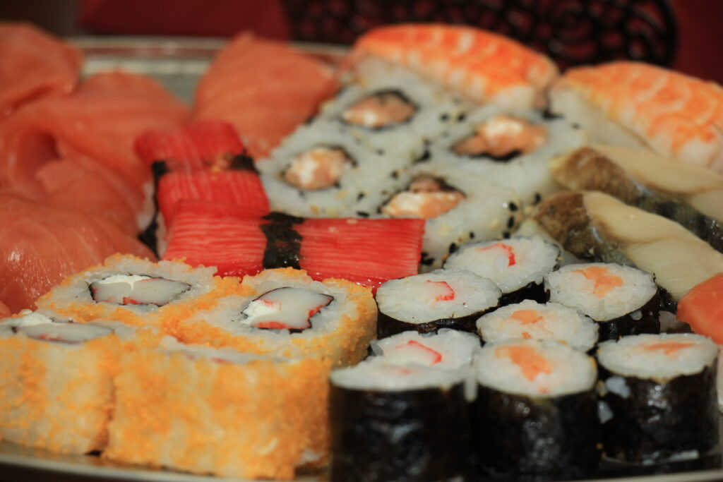 Japanese sushi and sashimi, various sorts on a serving plate